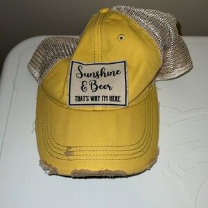 Yellow “sunshine and beer. That’s why I’m here” hat